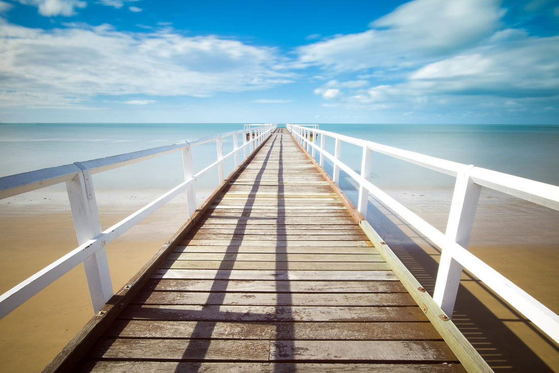 Pier over a beach to the water