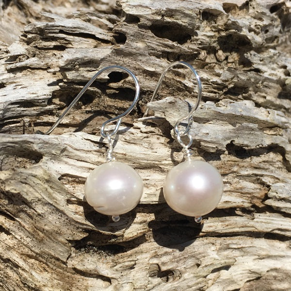 Freshwater Pearl Sterling Silver Earrings on a piece of driftwood